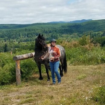 EquiSport Farm - Blue roan mustang mare on a mountaintop in the coast range mountains with her rider. - Pet Breeders Near Me - Yamhill, Oregon