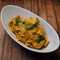 Italian Brothers Restaurant - PAPPARDELLE RUSTICA,
Mushrooms and peas in a Bolognese sauce with a touch 
of creamy sauce