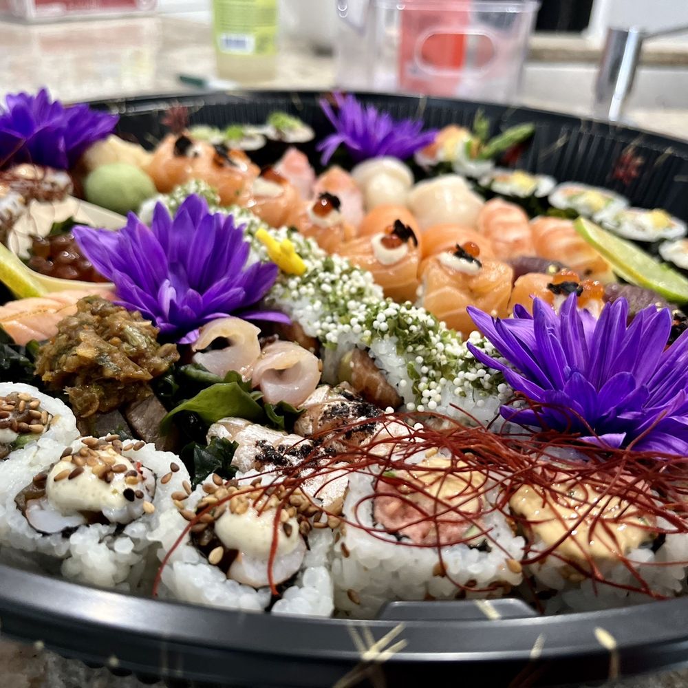 Sushi Fella - a plate of sushi with purple flowers - Sushi Bars Near Me - Lake Worth, Florida Sushi Fella - a plate of sushi with purple flowers - Sushi Bars Near Me - Lake Worth, Florida