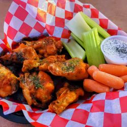Henry's Bar & Grill - Try some chicken wings with your choice of Buffalo, Teriyaki, Jerk, or Dry Rub served with ranch or blue cheese.