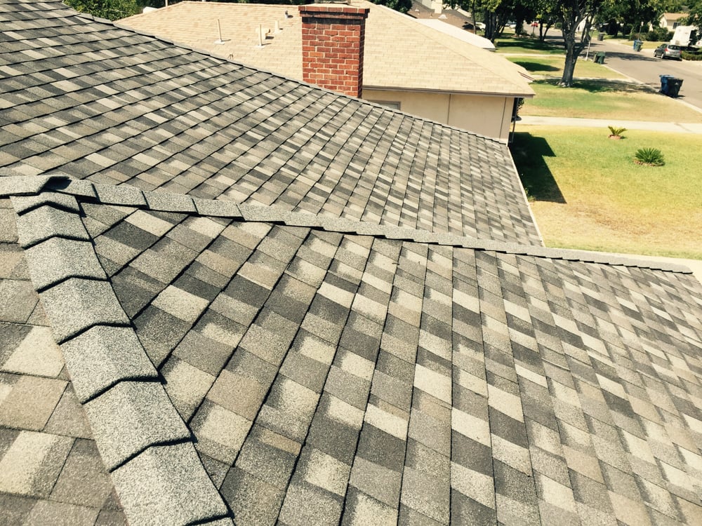 Slide of H&M ROOFING