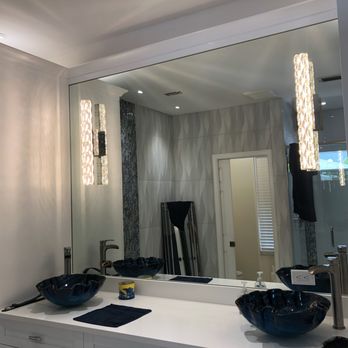 Towers Electric - Lighting sconces installed on mirror panel - Electricians Near Me
