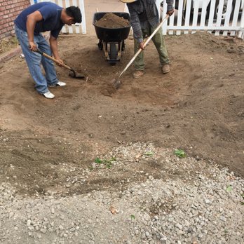 Synthetic Turf Pros - Photo 7 of 9 : Filling in the Gravel to ensure it has a sturdy foundation and noting grows up from the ground. - Landscaping Near Me