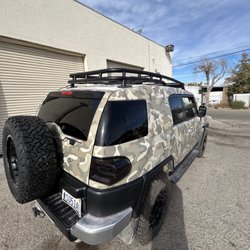 Santinis Vinyl & Automotive - Customer brought in his Toyota FJ for a custom camo wrap using TinyBot vinyl