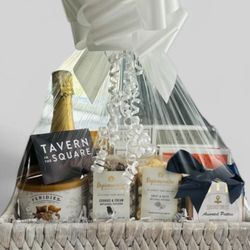 Bravo Baskets - Thank You basket to a client who referred new business. This included a bottle of Prosecco, snacks and gift card to a local restaurant.