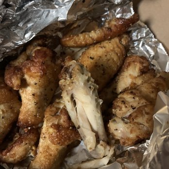Round Table Pizza - 7th piece in a 6 piece of wings that looks partially eaten - Pizza Near Me - San Diego, California