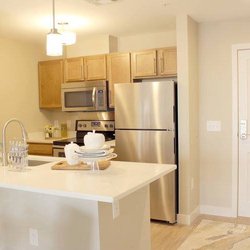 Residences at Riverwalk - A kitchen that will get you excited to meal prep! Enjoy your spacious prepping station or add some barstools to make the most of your space.