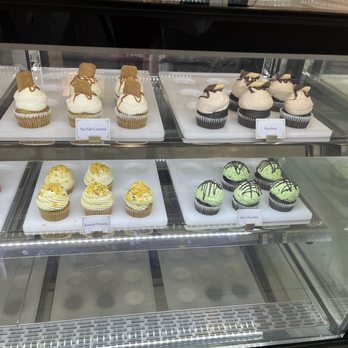 April Sweets - a variety of cupcakes in a display case - Desserts Near Me - Toronto, Ontario April Sweets - a variety of cupcakes in a display case - Desserts Near Me - Toronto, Ontario