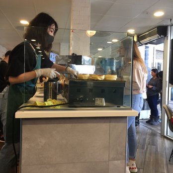 Motto Tea Cafe - Employee preparing the pancakes-clean station and wore a mask with gloves - Desserts Near Me - Pasadena, California Motto Tea Cafe - Employee preparing the pancakes-clean station and wore a mask with gloves - Desserts Near Me - Pasadena, California