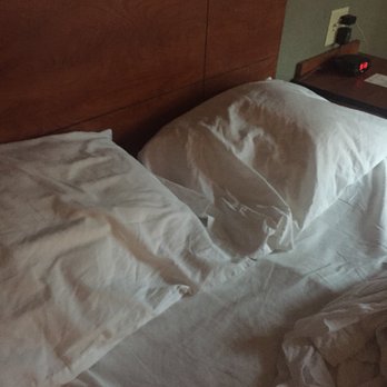 Woodspring Suites - These are the lumpy pillows, bar of soap that I'm guessing you use for everything and the nasty shower curtain - Hotels Near Me - Gainesville, Virginia