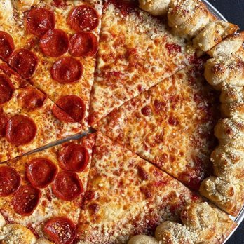 Sergio's - a pepperoni pizza cut into eight slices - Pizza Near Me - Riverhead, New York Sergio's - a pepperoni pizza cut into eight slices - Pizza Near Me - Riverhead, New York