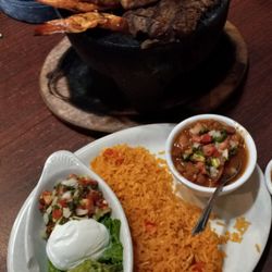 Hugo's Mexican Grill and Cantina - Pork, steak, chicken, sausage and grilled shrimp,  served with charro beans, grilled onions, guacamole, sour cream and tortillas. $25