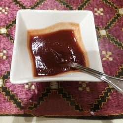 Kabab & Curry Restaurant & Grill - Tamarind Chutney. Sweet & spicy. Delicious on its own, or mixed with the yogurt-based green sauce that came with my entree.