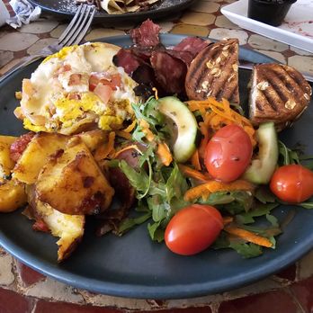 Pause Cafe - This is their omelette,  not really an omette and not very good.   Turkey bacon had a weird taste too - Moroccan Near Me - New York, New York