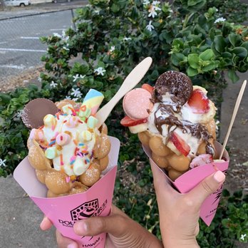 Double Three - Two vanilla bean ice creams in bubble waffle cones with toppings. - Ice Cream & Frozen Yogurt Near Me - Kailua, Hawaii Double Three - Two vanilla bean ice creams in bubble waffle cones with toppings. - Ice Cream & Frozen Yogurt Near Me - Kailua, Hawaii