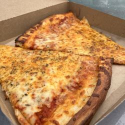 Pizza Stop - Big slices of cheese pizza.