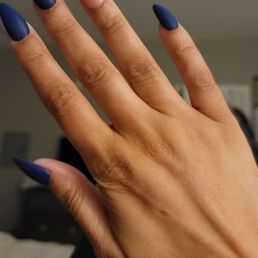 Almond shaped gel acrylics with custom accent design with a matte finish Almond shaped gel acrylics with custom accent design with a matte finish