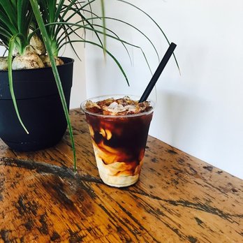 The Coffee Steamer - a cup of iced coffee on a wooden table - Coffee & Tea Near Me - Forrest, Illinois The Coffee Steamer - a cup of iced coffee on a wooden table - Coffee & Tea Near Me - Forrest, Illinois