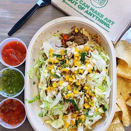 a taco salad and chips a taco salad and chips