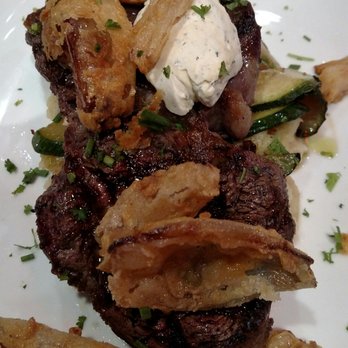 Redhead Lakeside Grill - The ribeye, parmesan mashed potatoes, deep fried shallots, steak butter, zucchini - Pizza Near Me - Osage Beach, Missouri Redhead Lakeside Grill - The ribeye, parmesan mashed potatoes, deep fried shallots, steak butter, zucchini - Pizza Near Me - Osage Beach, Missouri