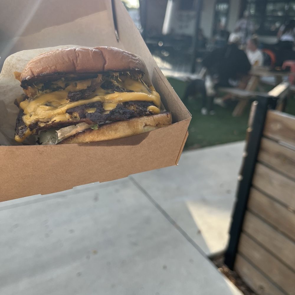 Tower 10 Burger with grilled onions, at a pop up food truck at Common Dialect Beerworks