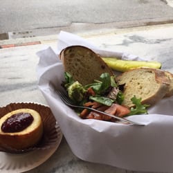 Pesto and tomato on sourdough with a side salad and raspberry cheesecake.