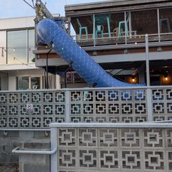 Slide going from upstairs balcony to downstairs balcony