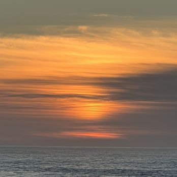 The Chelan Condominiums - Sunset out the large living room window! - Condominiums Near Me - Neskowin, Oregon