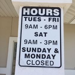 Bibi & Co Styling Salon - Hours posted by the door.