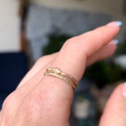 Top snake ring by Talking Tree Jewelry, lower gold band by Erin Cuff Jewelry