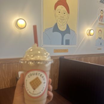 Cousteau's Waffle & Milkshake Bar  -  hand holding a cup of milkshake - Waffles Near Me - St. Augustine Beach, Florida
