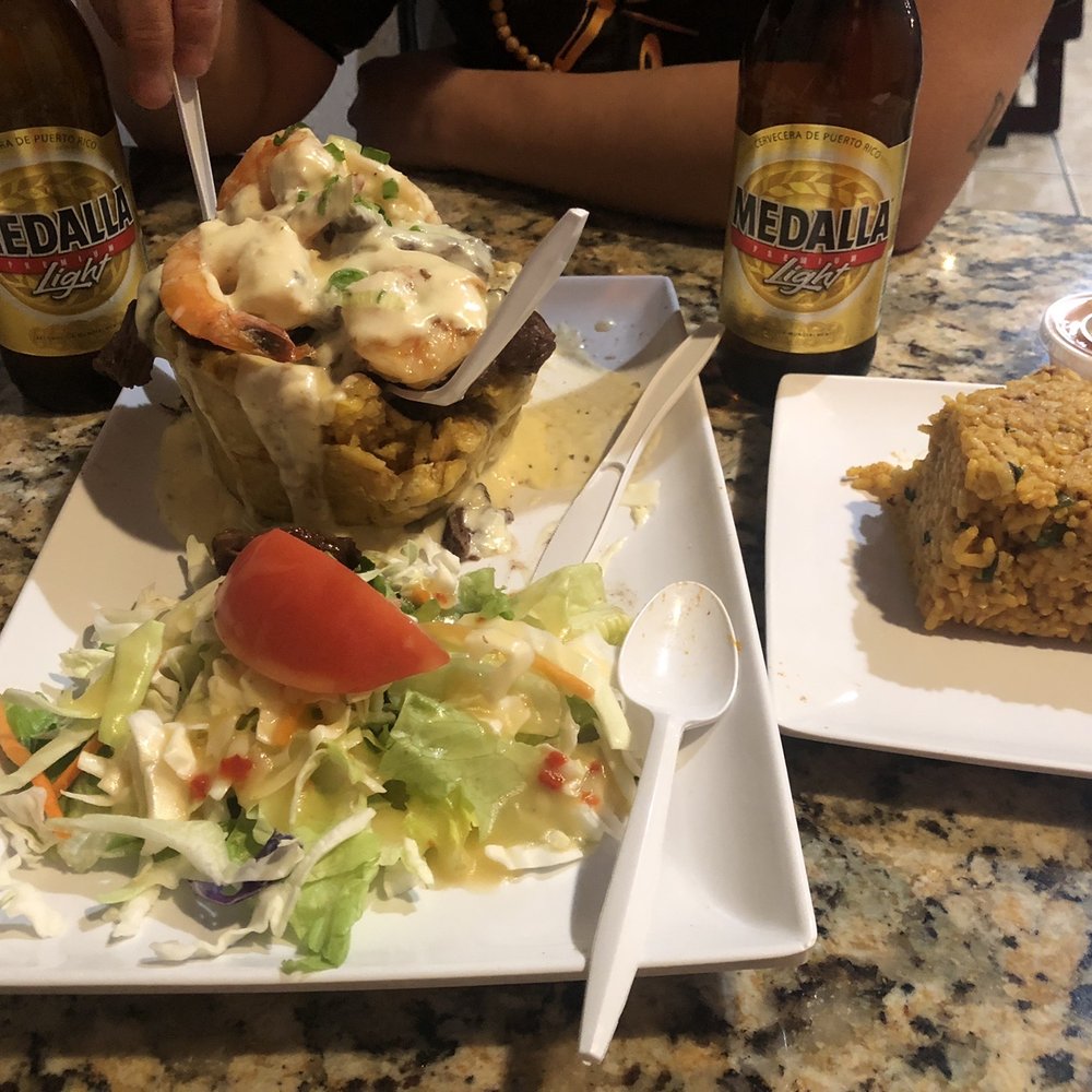 Grillers Puerto Rico - Mofongo Mar y Tierra, side of arroz momposteo & 2 beers. Total $40 - Puerto Rican Near Me - Orlando, Florida Grillers Puerto Rico - Mofongo Mar y Tierra, side of arroz momposteo & 2 beers. Total $40 - Puerto Rican Near Me - Orlando, Florida