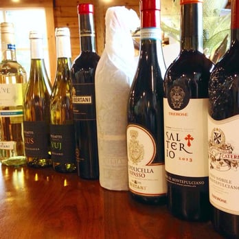 The Clown - a row of wine bottles on a table - Beer, Wine & Spirits Near Me - York, Maine