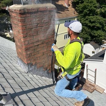 Rudys Masonry - Putting the finishing touches to chimney repointing, reattaching the old cap, acid washing, and applying waterproofing. - Masonry/Concrete Near Me - Chelsea, Massachusetts Rudys Masonry - Putting the finishing touches to chimney repointing, reattaching the old cap, acid washing, and applying waterproofing. - Masonry/Concrete Near Me - Chelsea, Massachusetts