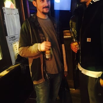 Johnny McGorey's - a guy holding a purse - Irish Pub Near Me - Massapequa Park, New York Johnny McGorey's - a guy holding a purse - Irish Pub Near Me - Massapequa Park, New York