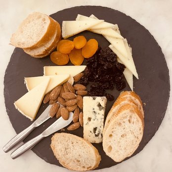 Truckle Cheesemongers - a plate of cheese, crackers, almonds, and dried apricots - Cheese Shops Near Me - Richmond, Virginia Truckle Cheesemongers - a plate of cheese, crackers, almonds, and dried apricots - Cheese Shops Near Me - Richmond, Virginia