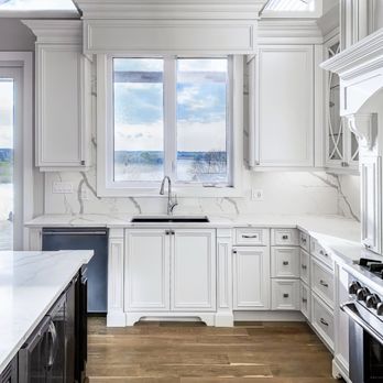 Azule Kitchens - Ryan Tilstra and Bethany Tilstra designed kitchen with breathtaking view in the background and decorative base board and toe boards. - Cabinetry Near Me - Hamilton, Ontario