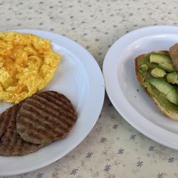 This is a full meal I had for breakfast really really good Highly recommend all of it! (Sausage, 2 egg scramble w cheese) and avocado toast!