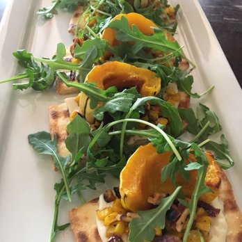 Veganized - The Sweet Corn is flatbread with seasonal butternut squash, charred corn, arugula, carmelized onions and cashew cheese. Friggin good!! - Vegan Near Me - New Brunswick, New Jersey Veganized - The Sweet Corn is flatbread with seasonal butternut squash, charred corn, arugula, carmelized onions and cashew cheese. Friggin good!! - Vegan Near Me - New Brunswick, New Jersey