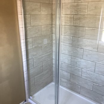 Cuvelier home Improvements - a shower with a glass door - Painters Near Me Cuvelier home Improvements - a shower with a glass door - Painters Near Me