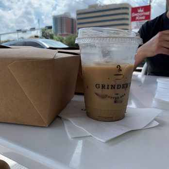 Grinder’s Coffee Bar - Honey lavender latte iced on the mini-patio - Coffee & Tea Near Me - Houston, Texas Grinder’s Coffee Bar - Honey lavender latte iced on the mini-patio - Coffee & Tea Near Me - Houston, Texas