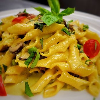 Fusion 27 - a plate of pasta with mushrooms and tomatoes - Latin American Near Me - Totowa, New Jersey Fusion 27 - a plate of pasta with mushrooms and tomatoes - Latin American Near Me - Totowa, New Jersey