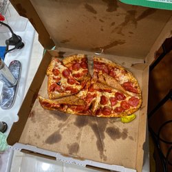 Papa Johns Pizza - Pizza that the delivery guy dropped on the floor before he delivered to us.
