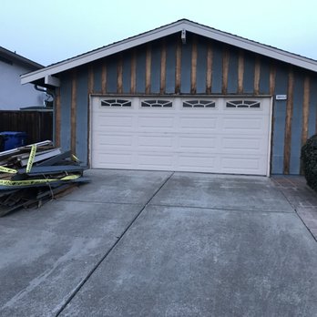 Allstar Construction Innovations - a garage with a snowmobile parked in front of it - General Contractors Near Me