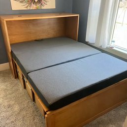 Fully extended bed with foldable mattress.