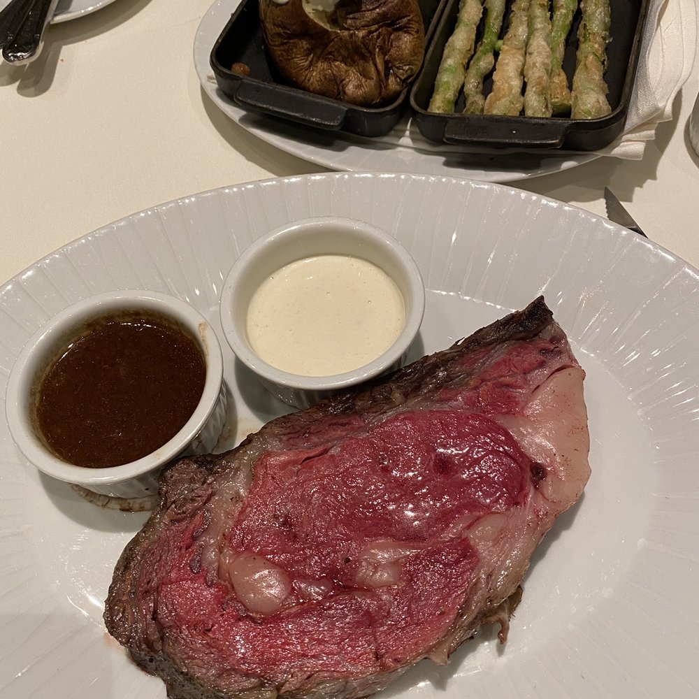 Henry's Steakhouse - Prime rib with choice of two sides - loaded baked potato and tempura asparagus - Steakhouses Near Me - Placerville, California