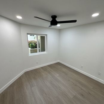 Lusso Design and Build - Remodeled bedroom-Low profile ceiling fan, recessed lighting, new paint, new LVP flooring, closet system install - General Contractors Near Me - San Diego, California Lusso Design and Build - Remodeled bedroom-Low profile ceiling fan, recessed lighting, new paint, new LVP flooring, closet system install - General Contractors Near Me - San Diego, California