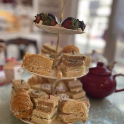 Enchanted Rose Tea Parlour - Beautiful and tasty sandwich bites arranged on tiered serving dish