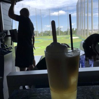 Topgolf - The mai tai with the coconut ice pop in it. Perfect way to cool down! - New American Near Me - Orlando, Florida