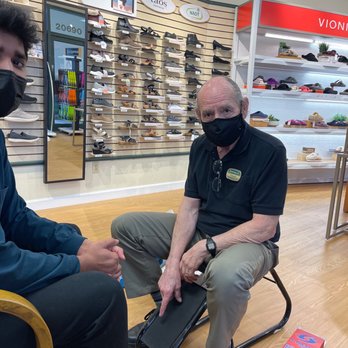 Footwear etc. - Dr Caesar helping us with our shoes!! - Shoe Stores Near Me - Cupertino, California